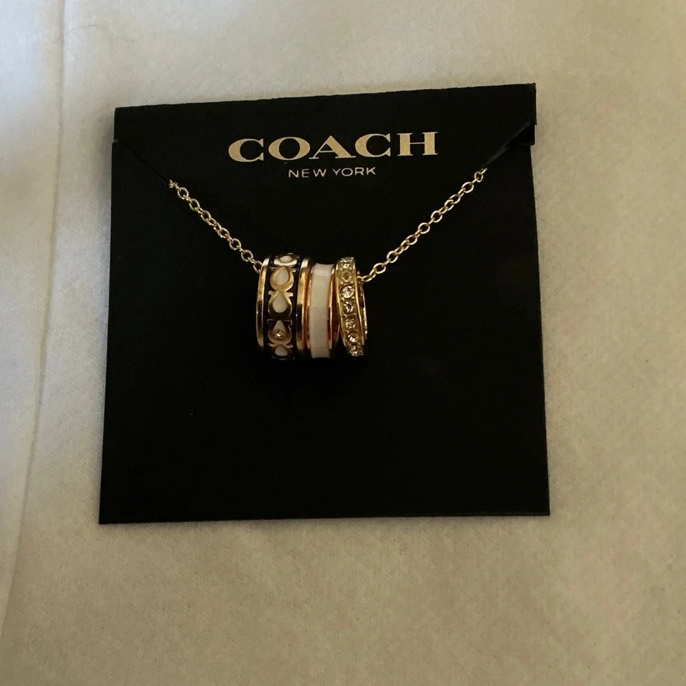 COACH Gold-Tone Multi-Ring Pendant Necklace with White Enamel